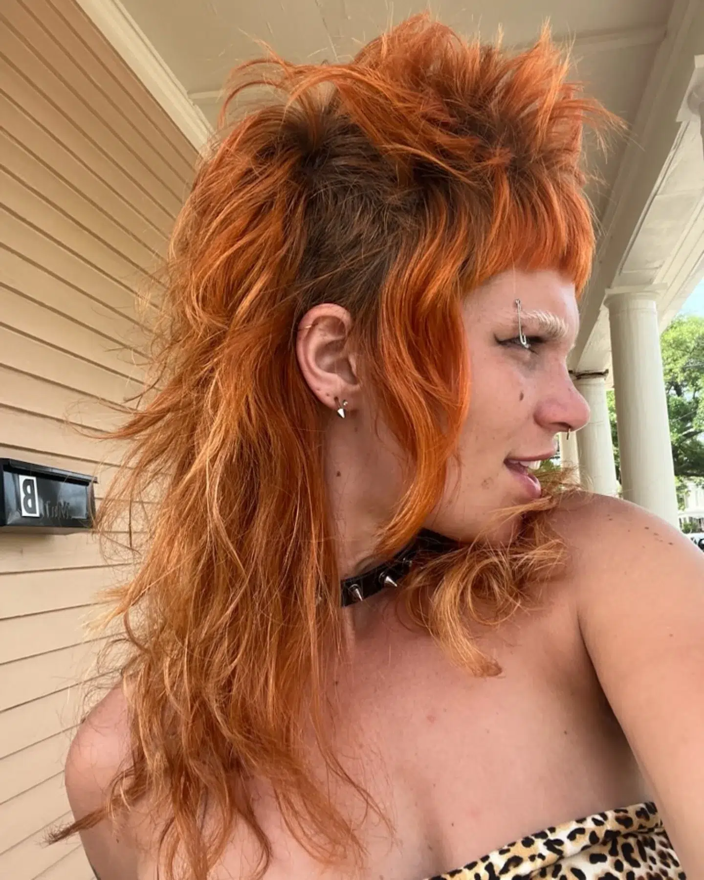 13. Radiant Rebel: a Fiery Mullet with Edgy Layers